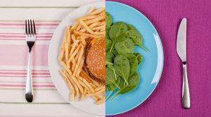 plate with salad and a hamburger